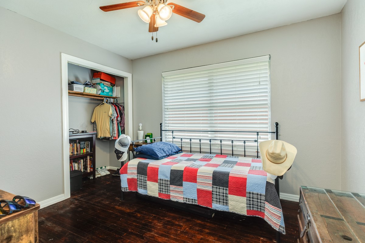 2109 North Tinsley Street Angleton, TX 77515 - Photo 24 of 27 a bedroom with furniture and a window