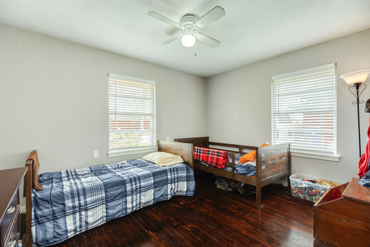 2109 North Tinsley Street Angleton, TX 77515 - Photo 25 of 27 a bedroom with bed and a couch