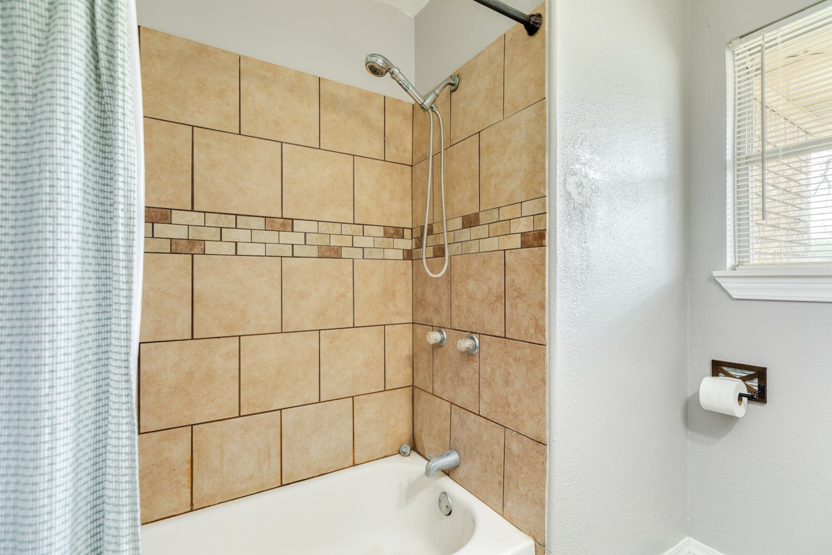 2109 North Tinsley Street Angleton, TX 77515 - Photo 27 of 27 a bathroom with a bathtub