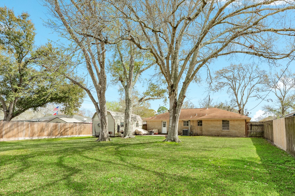 2109 North Tinsley Street Angleton, TX 77515 - Photo 6 of 27 a view of a house with a yard