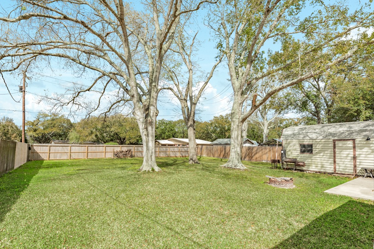 2109 North Tinsley Street Angleton, TX 77515 - Photo 7 of 27 a view of yard with swimming pool