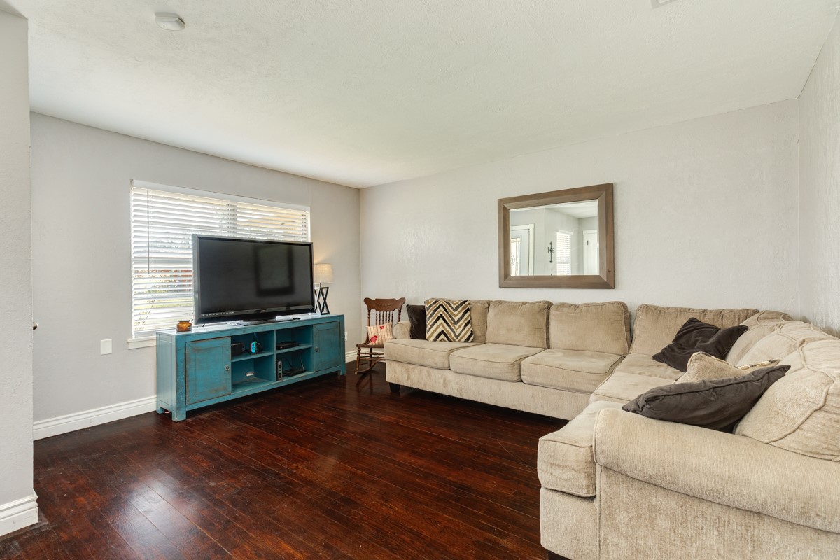 2109 North Tinsley Street Angleton, TX 77515 - Photo 10 of 27 a living room with furniture and a flat screen tv