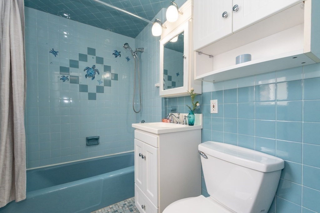 20 Maynard Place Cambridge, MA 02138 - Photo 23 of 42 a white toilet sitting next to a bath tub