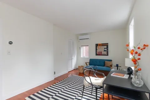 a view of a workspace with furniture