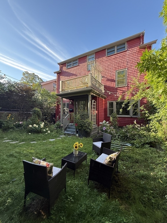 20 Maynard Place Cambridge, MA 02138 - Photo 35 of 42 a backyard of a house with outdoor seating