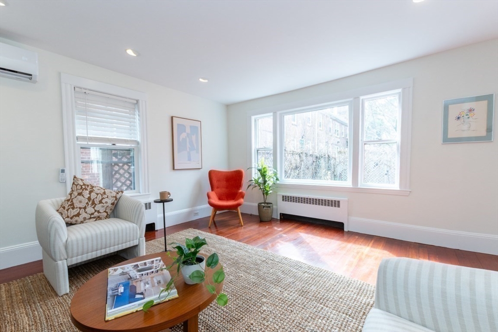 20 Maynard Place Cambridge, MA 02138 - Photo 10 of 42 a living room with furniture and a large window
