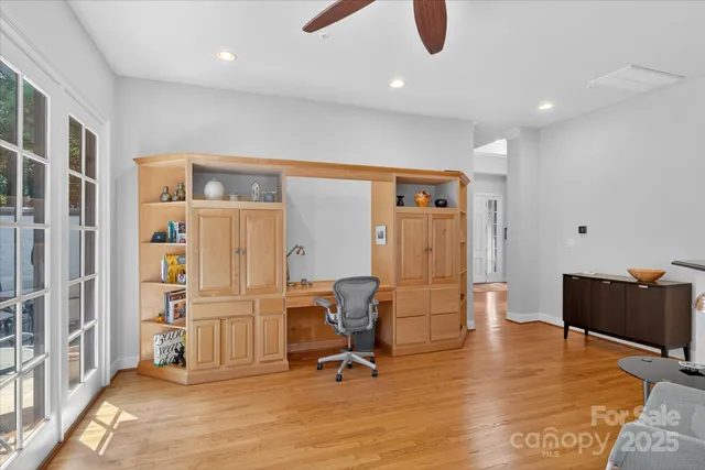 a view of a livingroom with furniture and a ceiling fan