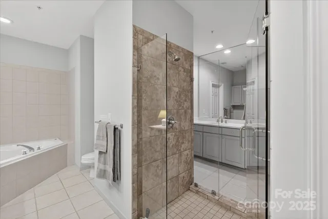 a bathroom with a shower and a sink