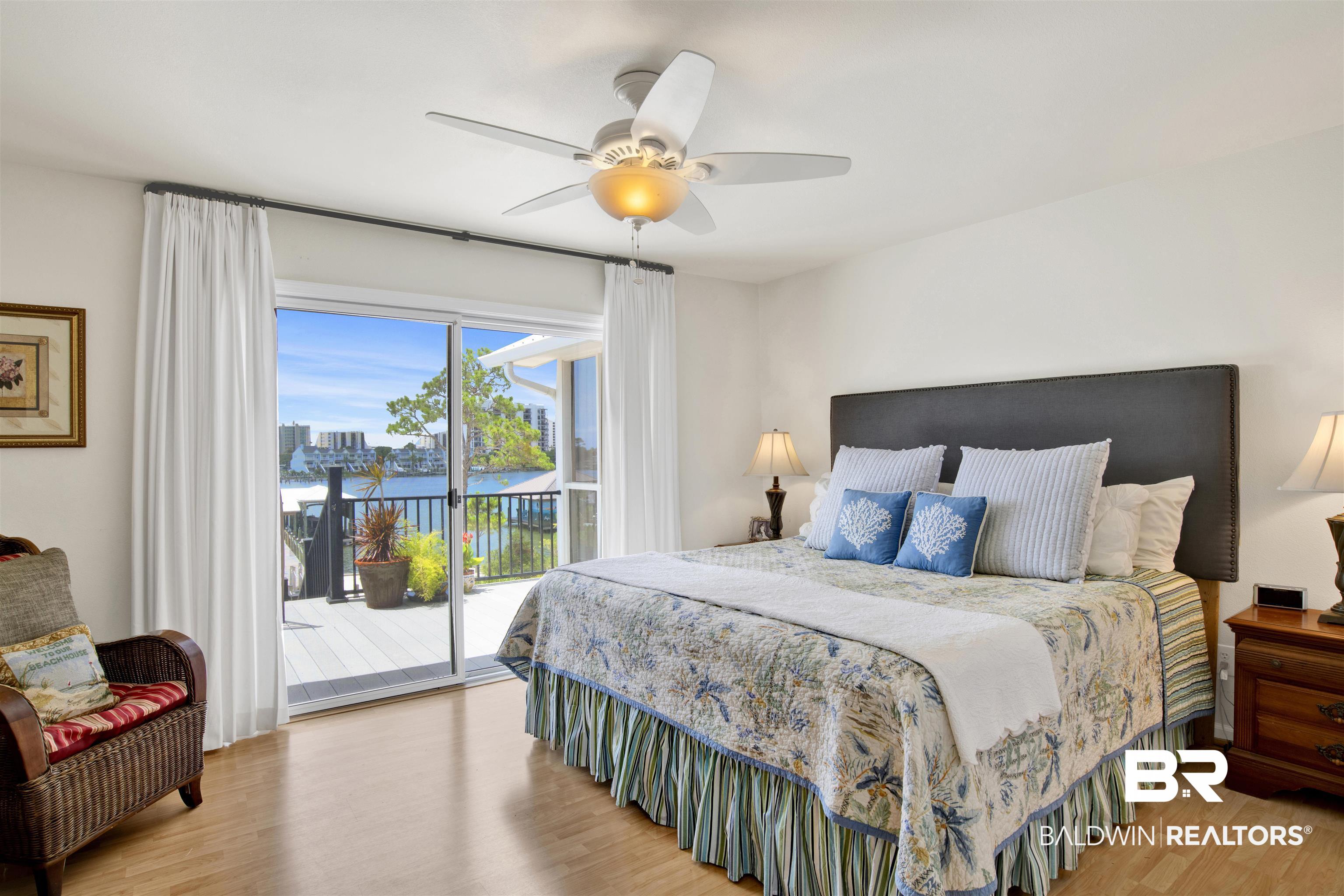 30538 River Road Orange Beach, AL 36561 - Photo 37 of 78 Bedroom featuring access to outside, wood finished floors, and ceiling fan