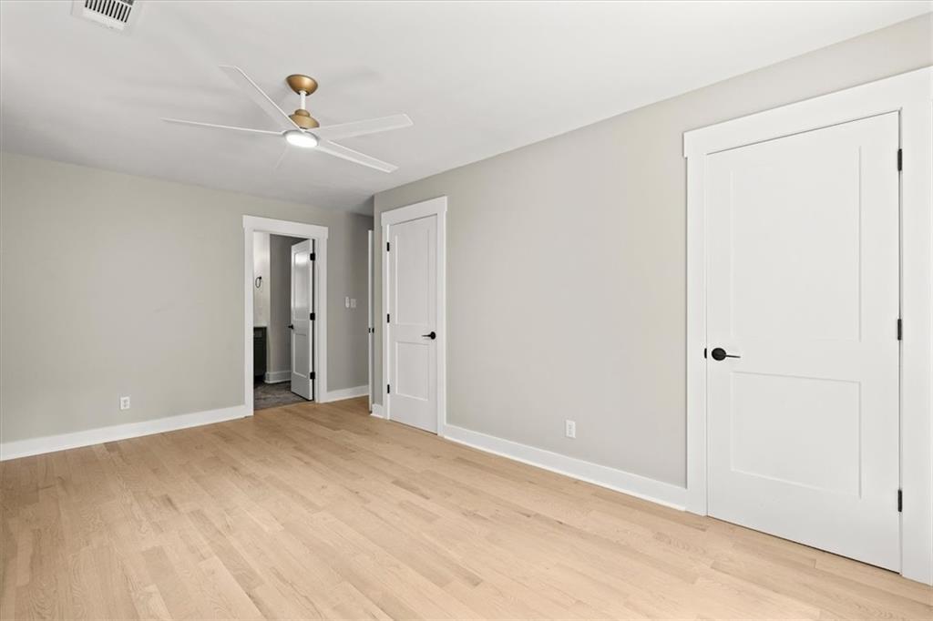 2237 Clem Lowell Road Carrollton, GA 30116 - Photo 14 of 60 a view of an empty room with chandelier fan