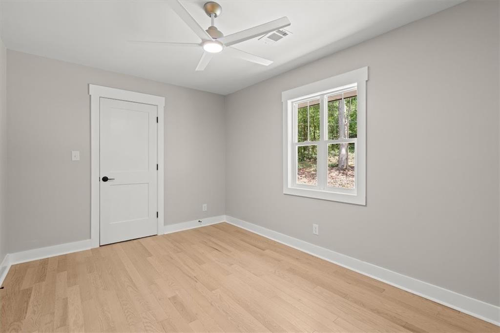 2237 Clem Lowell Road Carrollton, GA 30116 - Photo 18 of 60 a view of an empty room with a window
