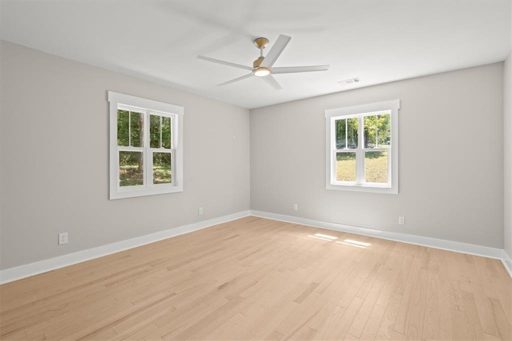2237 Clem Lowell Road Carrollton, GA 30116 - Photo 20 of 60 an empty room with window and ceiling fan