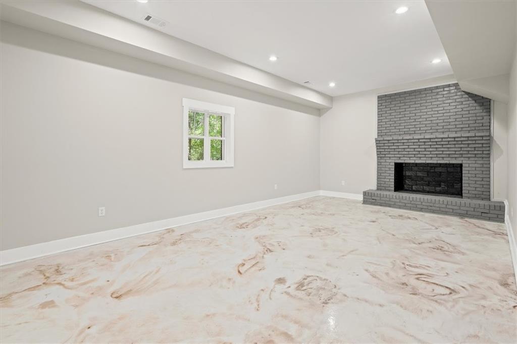 2237 Clem Lowell Road Carrollton, GA 30116 - Photo 27 of 60 an empty room with a fireplace
