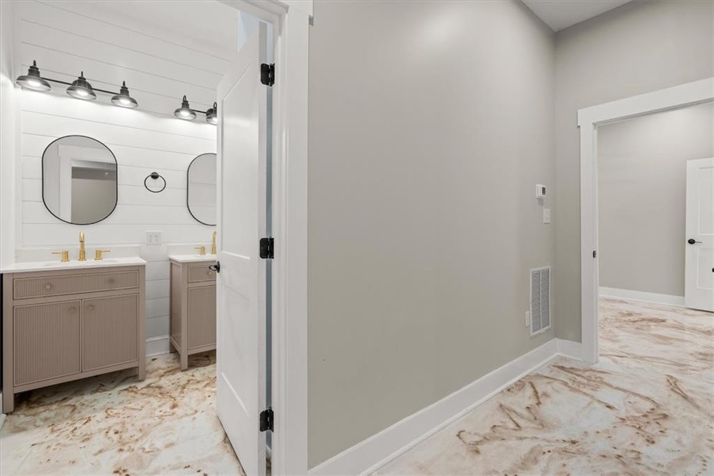 2237 Clem Lowell Road Carrollton, GA 30116 - Photo 29 of 60 a bathroom with a sink and a mirror