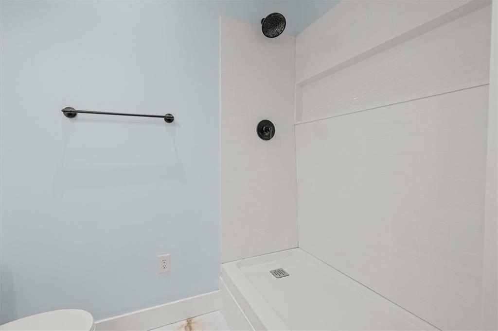 2237 Clem Lowell Road Carrollton, GA 30116 - Photo 31 of 60 a bathroom with a bath tub and a shower