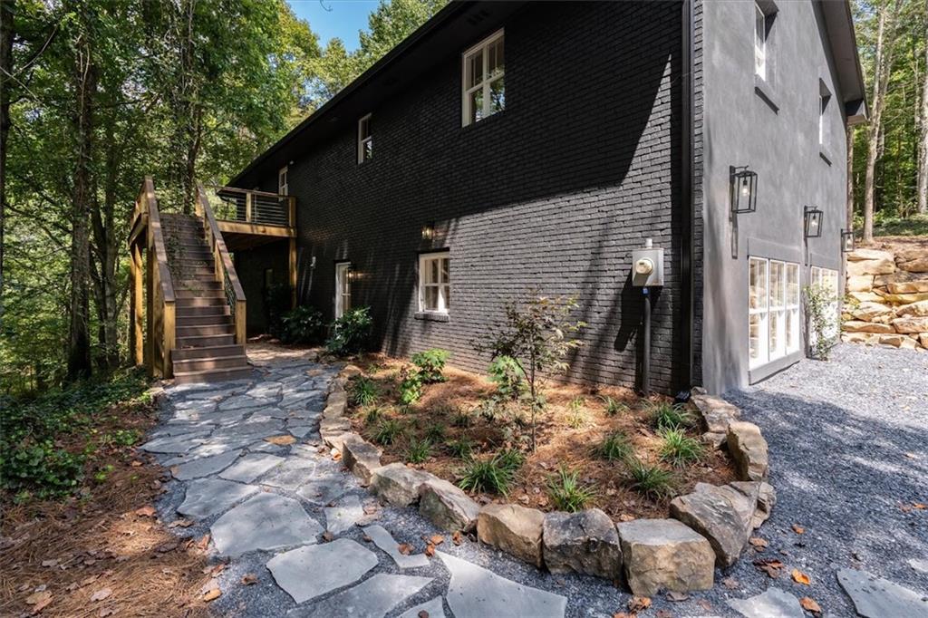 2237 Clem Lowell Road Carrollton, GA 30116 - Photo 35 of 60 a backyard of a house with lots of green space