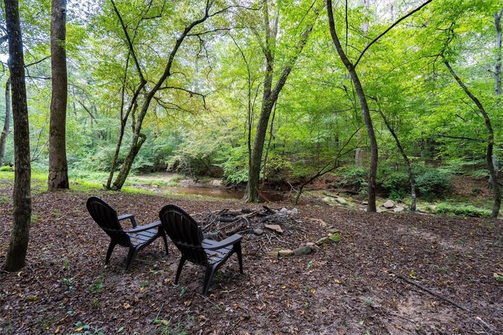 2237 Clem Lowell Road Carrollton, GA 30116 - Photo 51 of 60 a view of a yard with a sitting area and furniture
