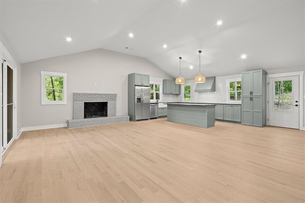 2237 Clem Lowell Road Carrollton, GA 30116 - Photo 9 of 60 a view of a kitchen with a sink and a fireplace