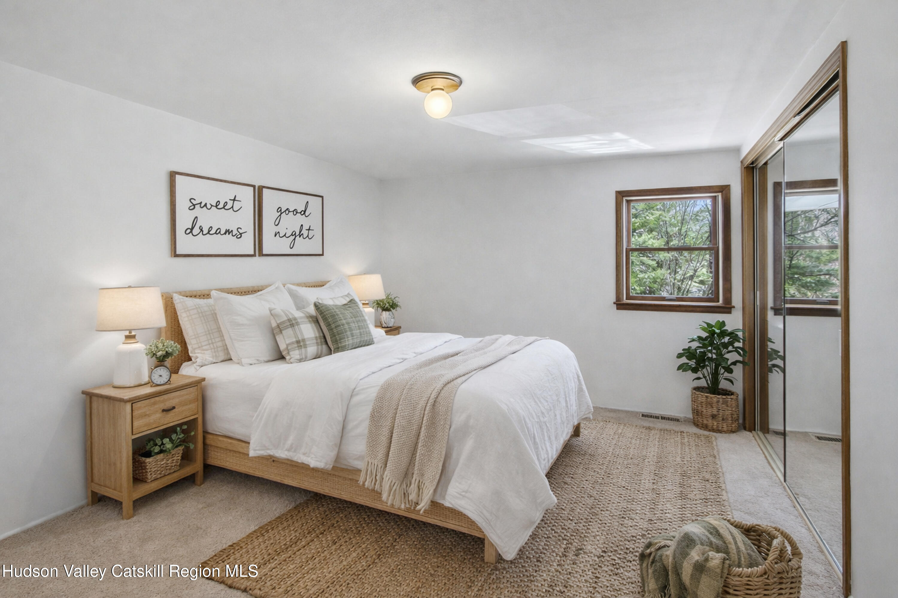 524 Angel Hill Road Chatham, NY 12037 - Photo 30 of 33 a bedroom with a bed and a potted plant