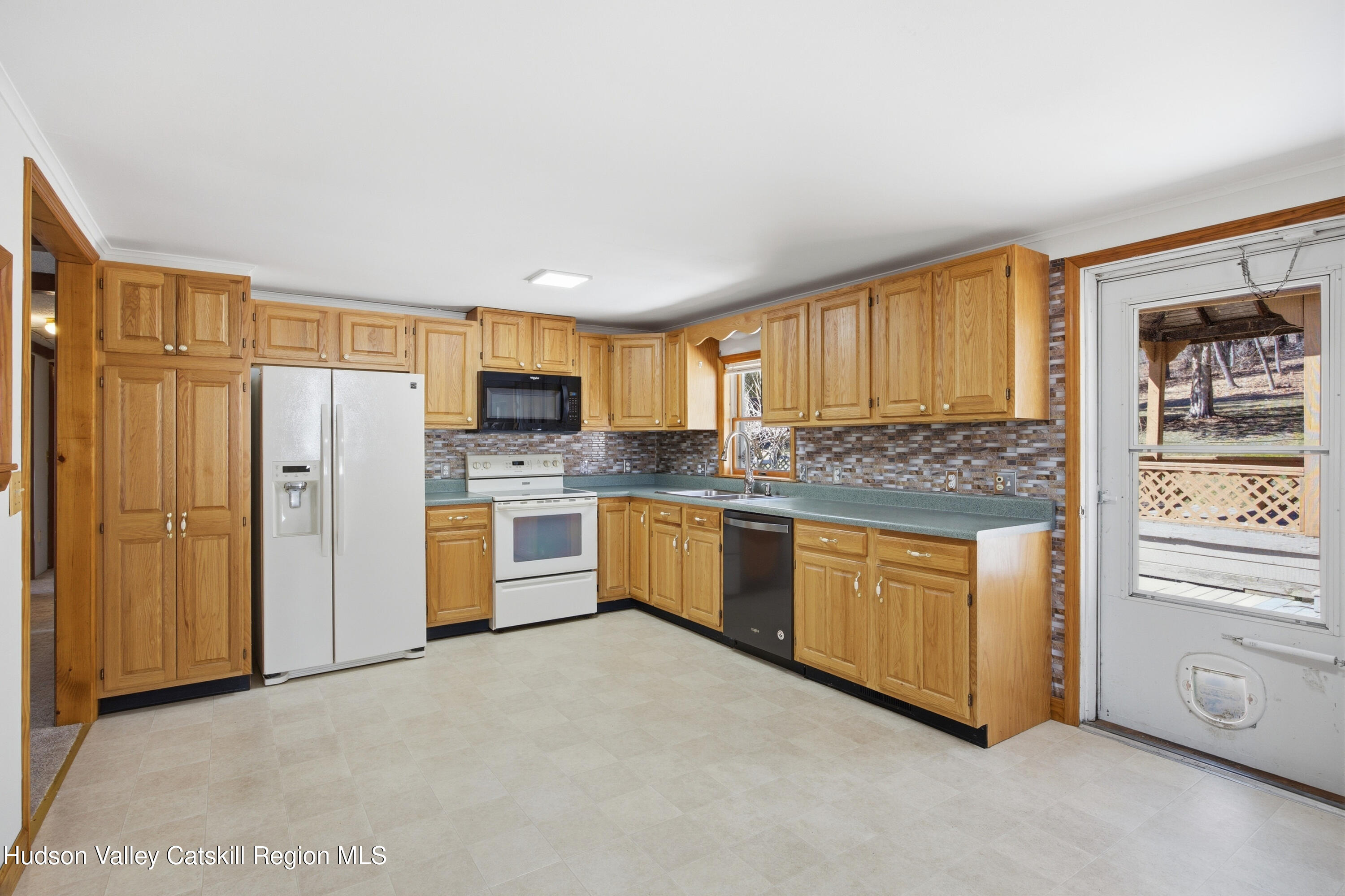524 Angel Hill Road Chatham, NY 12037 - Photo 8 of 33 a kitchen with stainless steel appliances granite countertop a refrigerator and cabinets