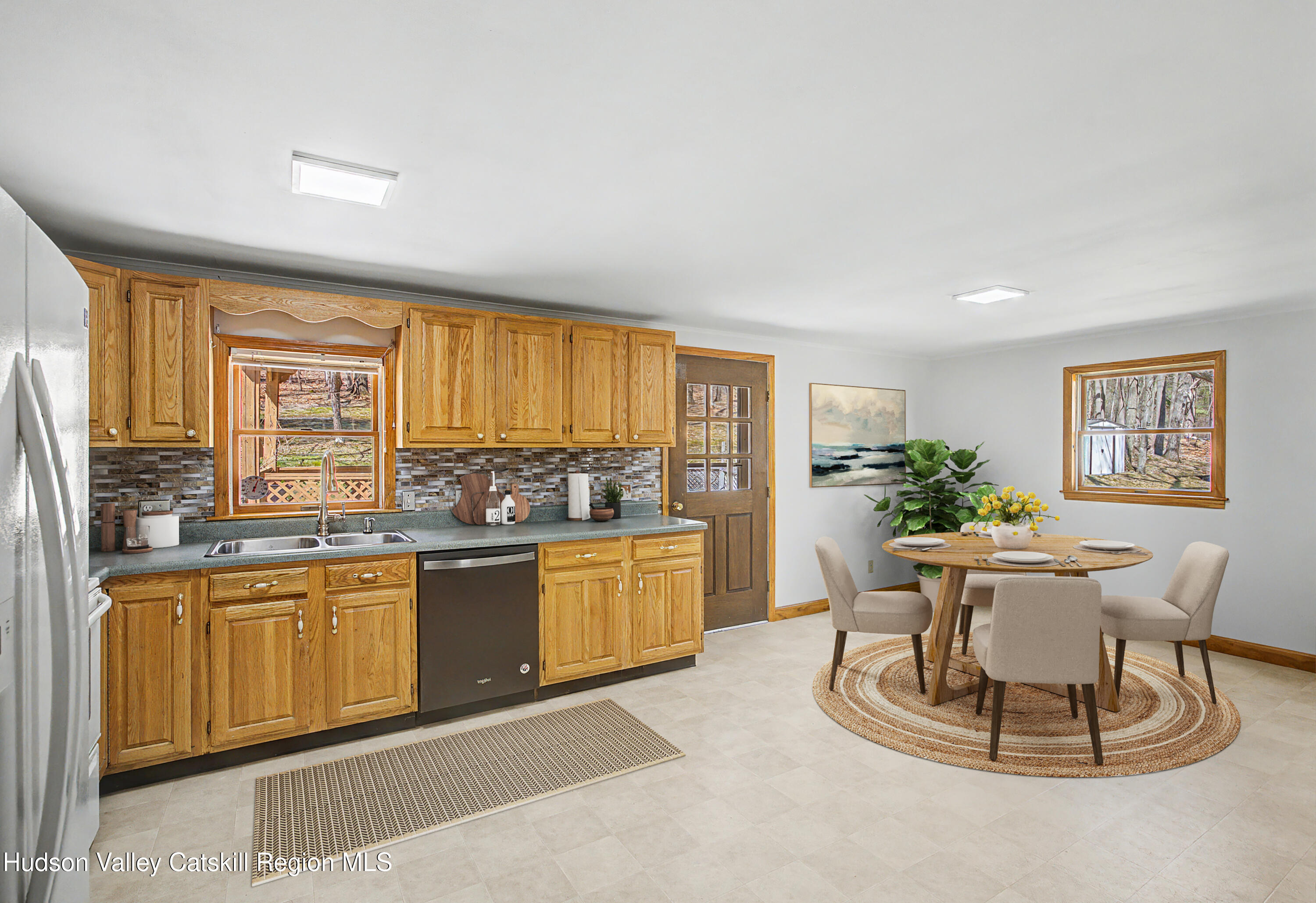 524 Angel Hill Road Chatham, NY 12037 - Photo 9 of 33 a kitchen with a table and chairs in it