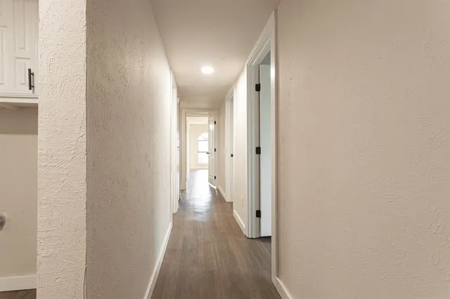 a bathroom with a toilet a sink a mirror and vanity
