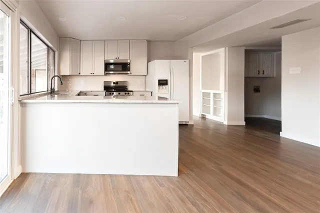 wooden floor and kitchen view