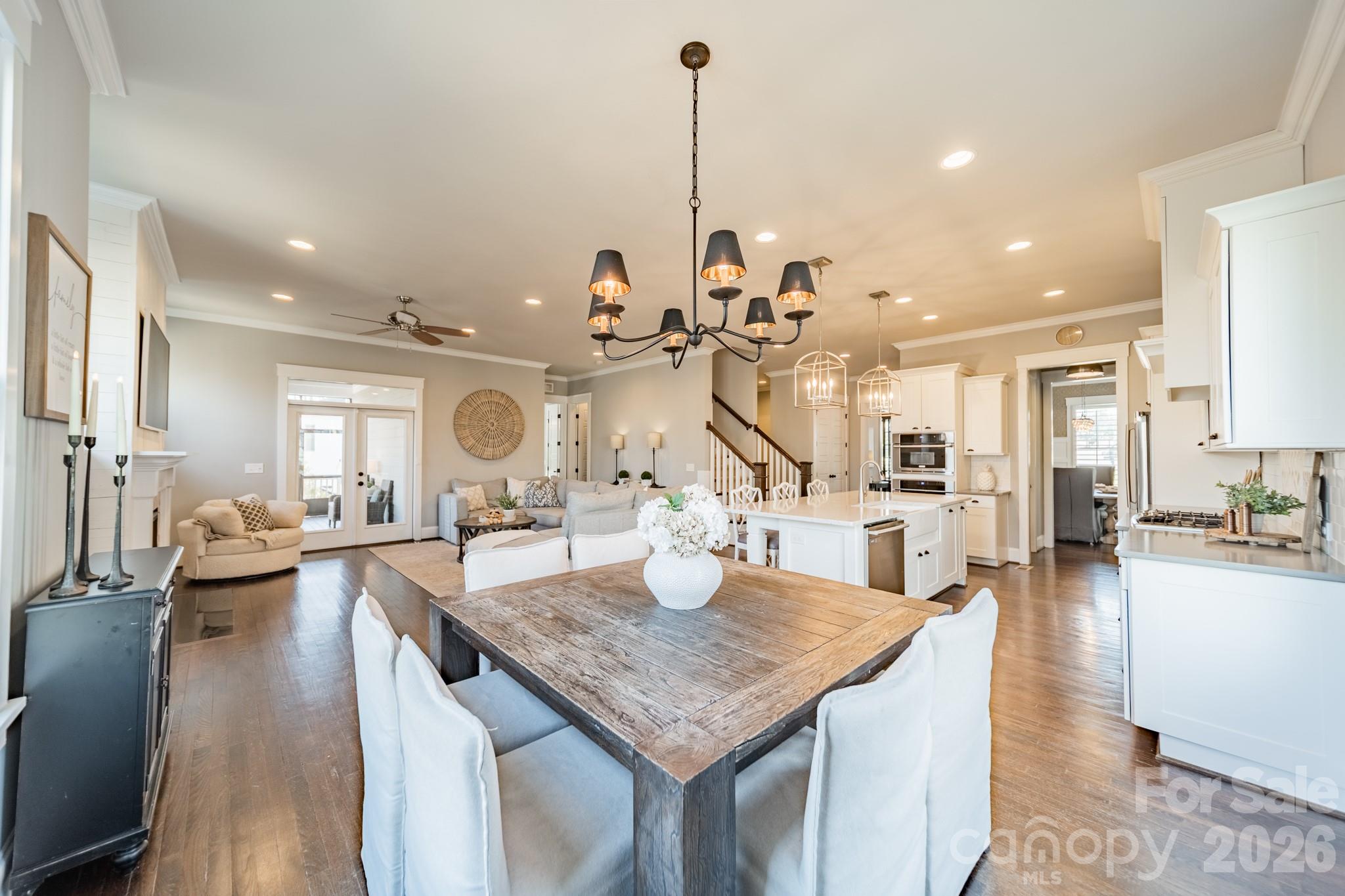 2289 Tatton Hall Road Fort Mill, SC 29715 - Photo 15 of 48 a kitchen island with granite countertop lots of counter top space and living room view