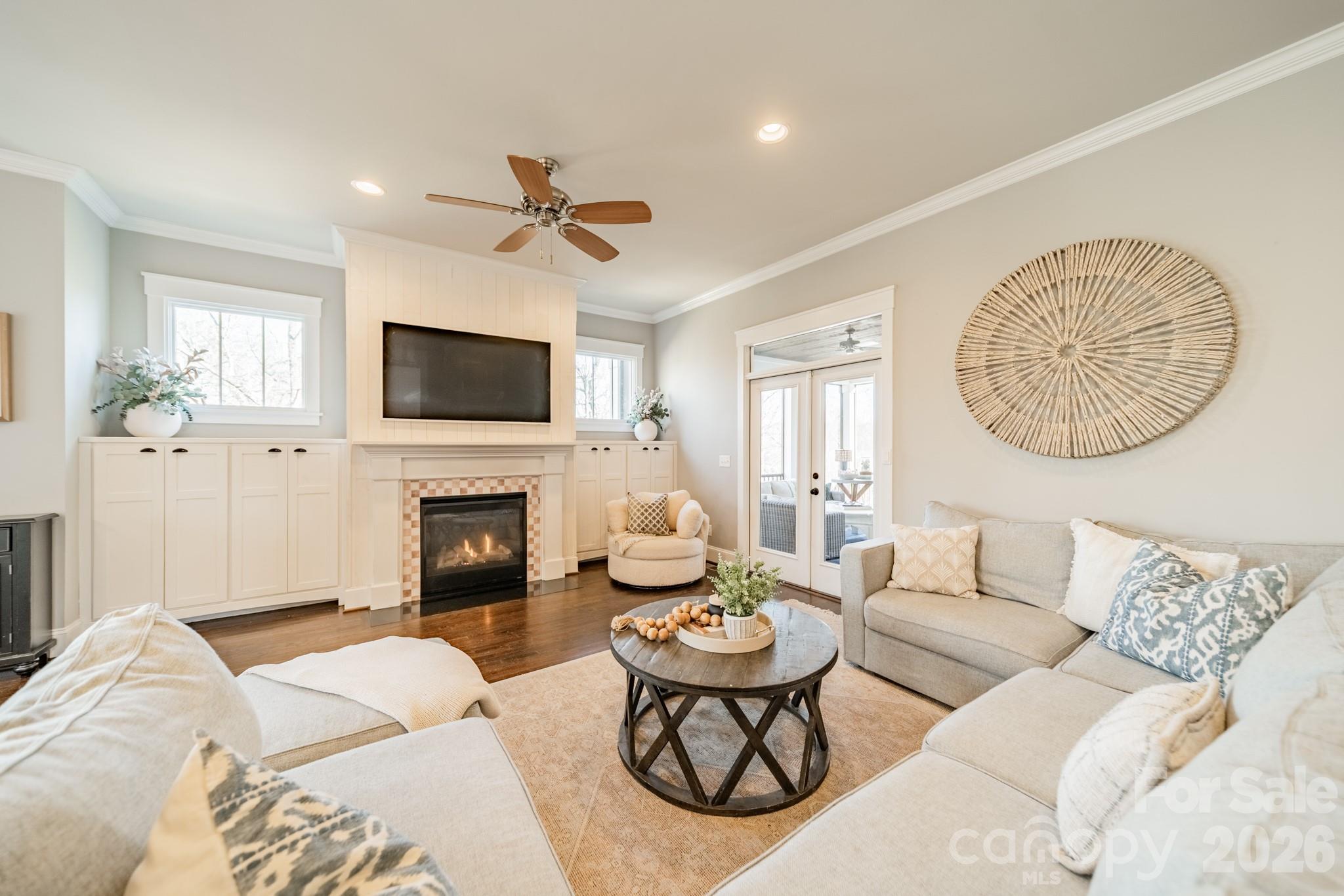 2289 Tatton Hall Road Fort Mill, SC 29715 - Photo 16 of 48 a living room with furniture a fireplace and a flat screen tv