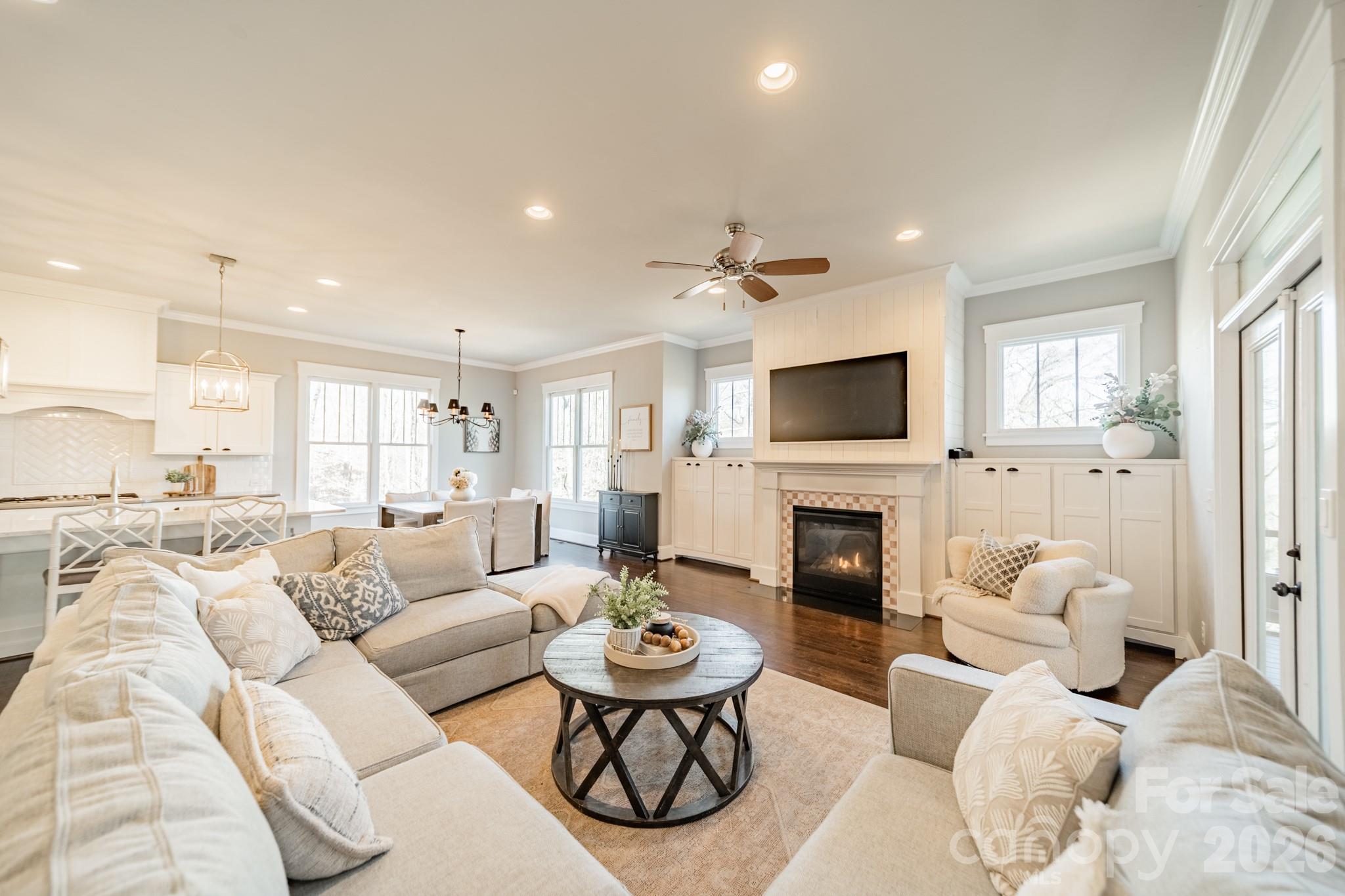 2289 Tatton Hall Road Fort Mill, SC 29715 - Photo 17 of 48 a living room with furniture a fireplace and a flat screen tv