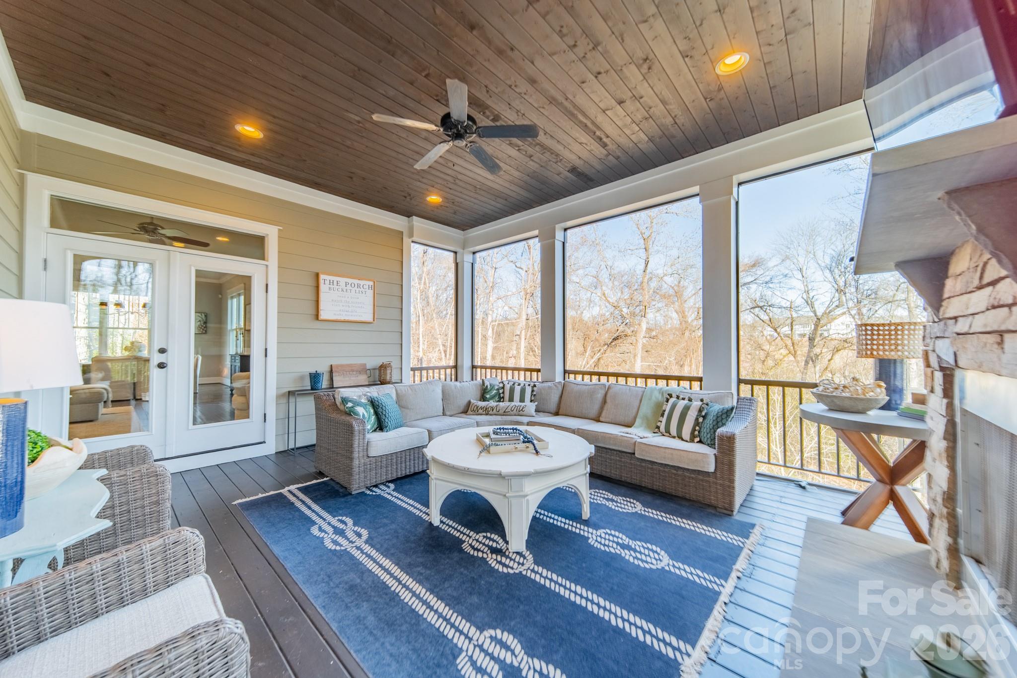 2289 Tatton Hall Road Fort Mill, SC 29715 - Photo 21 of 48 a living room with couches a dining table and chairs with wooden floor
