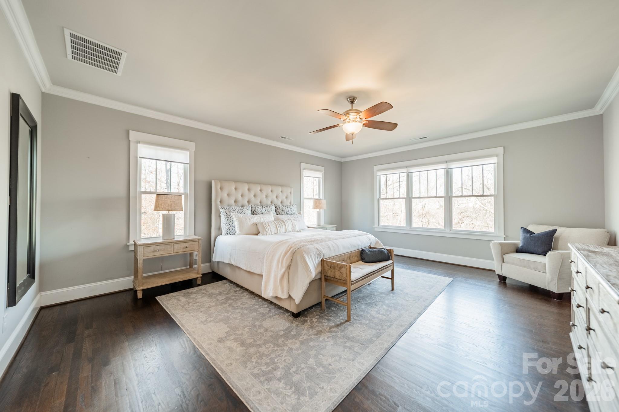 2289 Tatton Hall Road Fort Mill, SC 29715 - Photo 23 of 48 a spacious bedroom with a bed and wooden floor