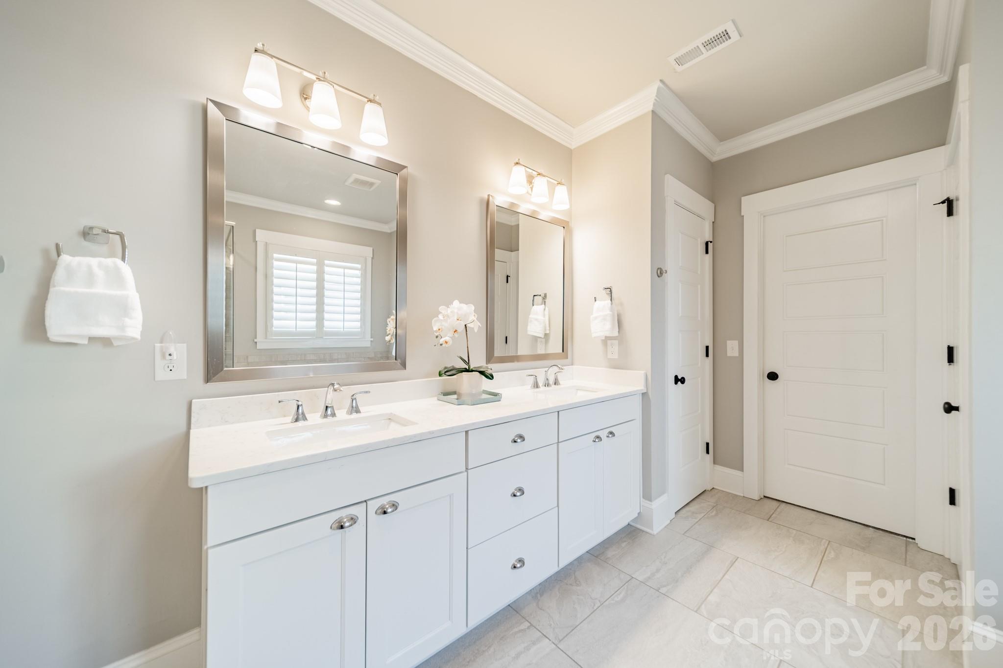 2289 Tatton Hall Road Fort Mill, SC 29715 - Photo 25 of 48 a spacious bathroom with a double vanity sink mirror and