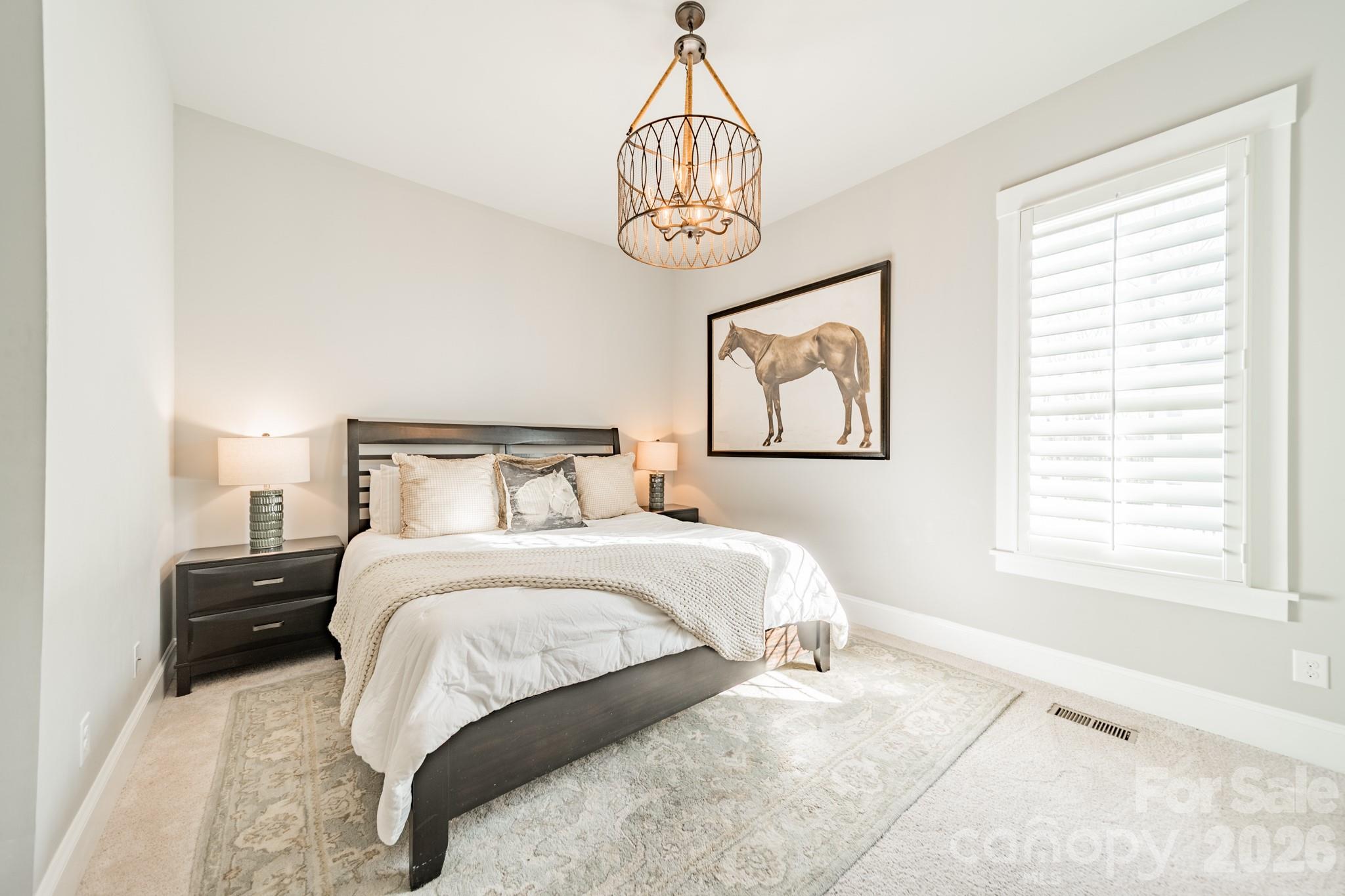 2289 Tatton Hall Road Fort Mill, SC 29715 - Photo 27 of 48 a bedroom with a bed and a window