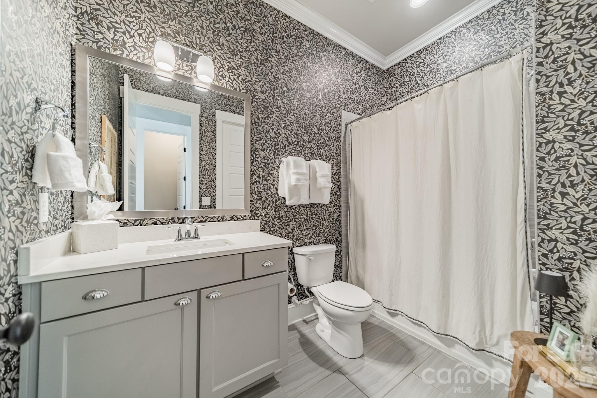2289 Tatton Hall Road Fort Mill, SC 29715 - Photo 29 of 48 a bathroom with a toilet a sink and a mirror