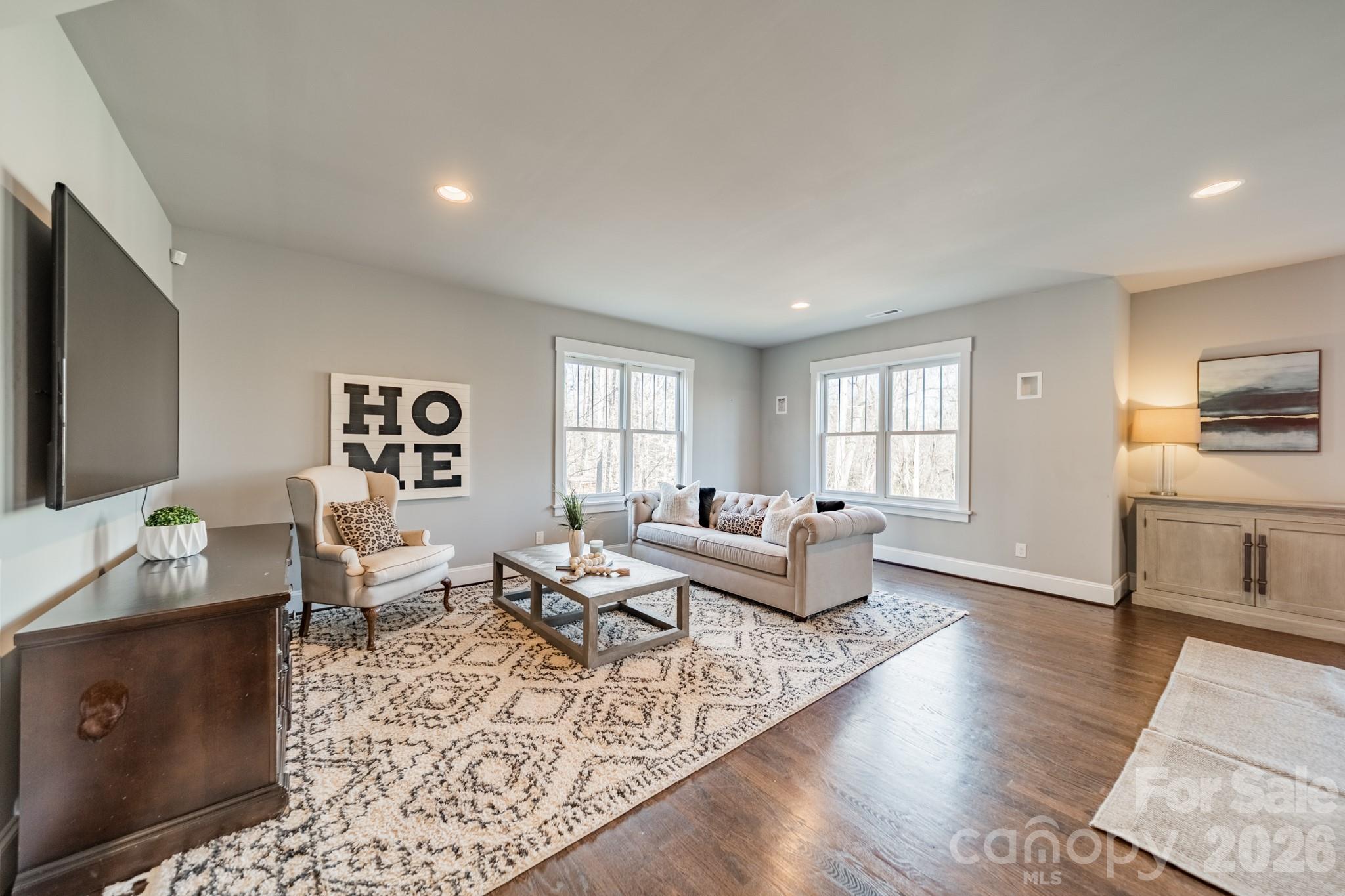 2289 Tatton Hall Road Fort Mill, SC 29715 - Photo 39 of 48 a living room with furniture and a flat screen tv