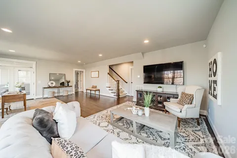 a bedroom with a bed and a lamp with window