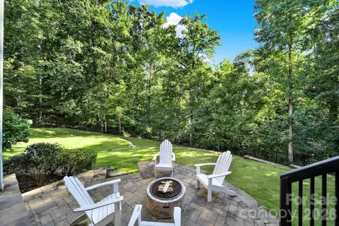 a backyard of a house with large trees