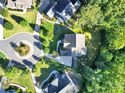 an aerial view of a swimming pool and outdoor space