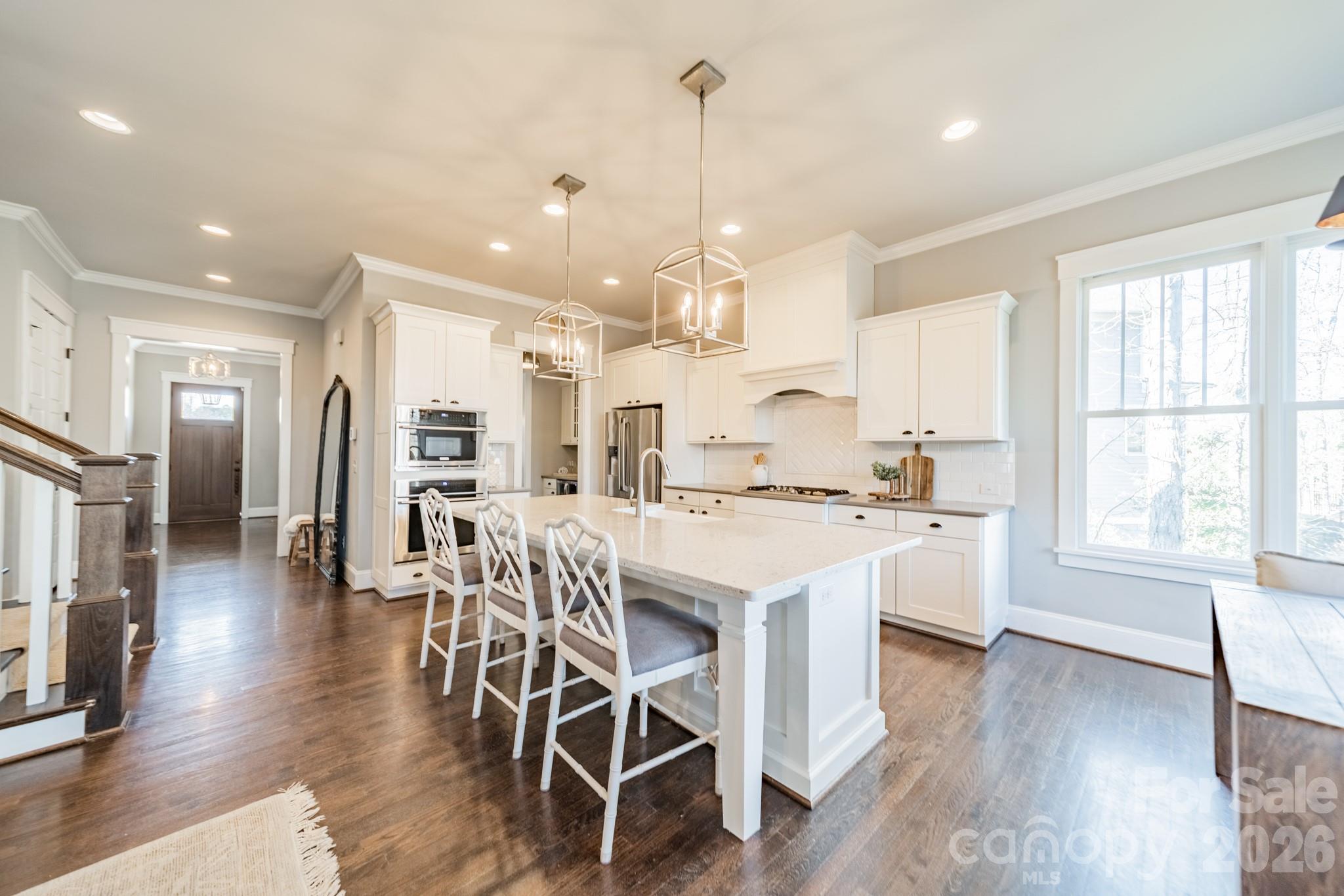 2289 Tatton Hall Road Fort Mill, SC 29715 - Photo 9 of 48 a large kitchen with a table and chairs