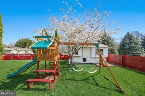 a front view of a house with a yard table and chairs