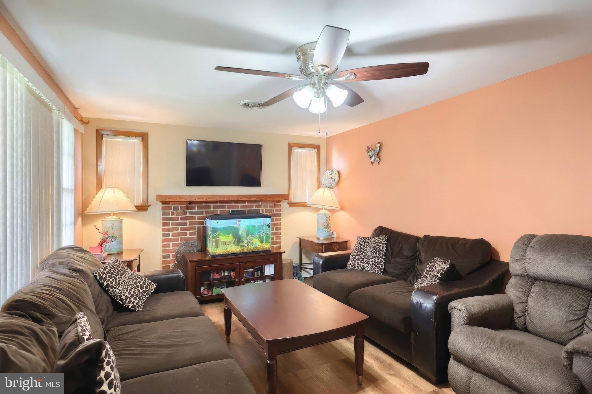 2208 Grandview Road Hanover, PA 17331 - Photo 18 of 39 a living room with furniture a ceiling fan and a flat screen tv