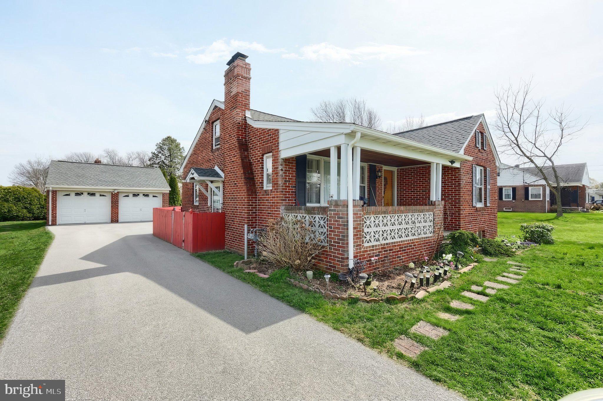 2208 Grandview Road Hanover, PA 17331 - Photo 2 of 39 a front view of a house with a yard and garage