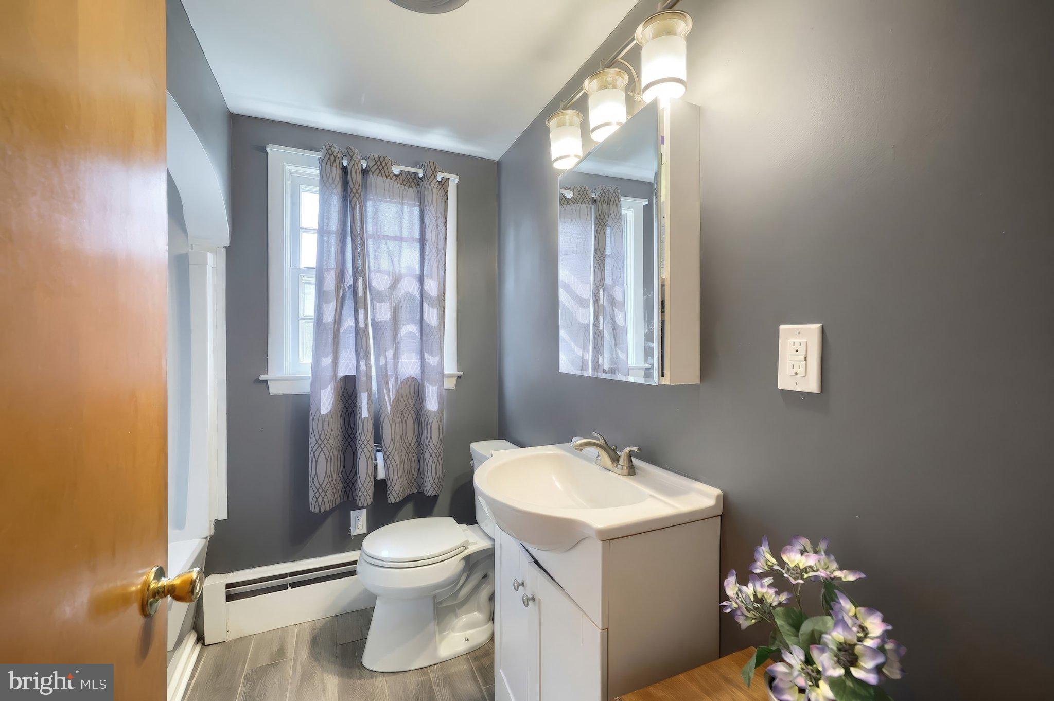 2208 Grandview Road Hanover, PA 17331 - Photo 24 of 39 a bathroom with a toilet sink and mirror