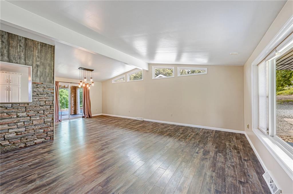 812 Buchanan Road White, PA 15490 - Photo 3 of 35 wooden floor in an empty room with a window
