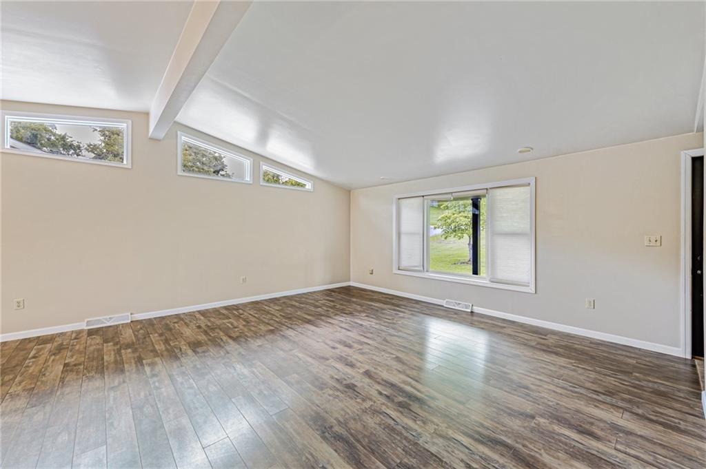 812 Buchanan Road White, PA 15490 - Photo 4 of 35 a view of an empty room with wooden floor and a window
