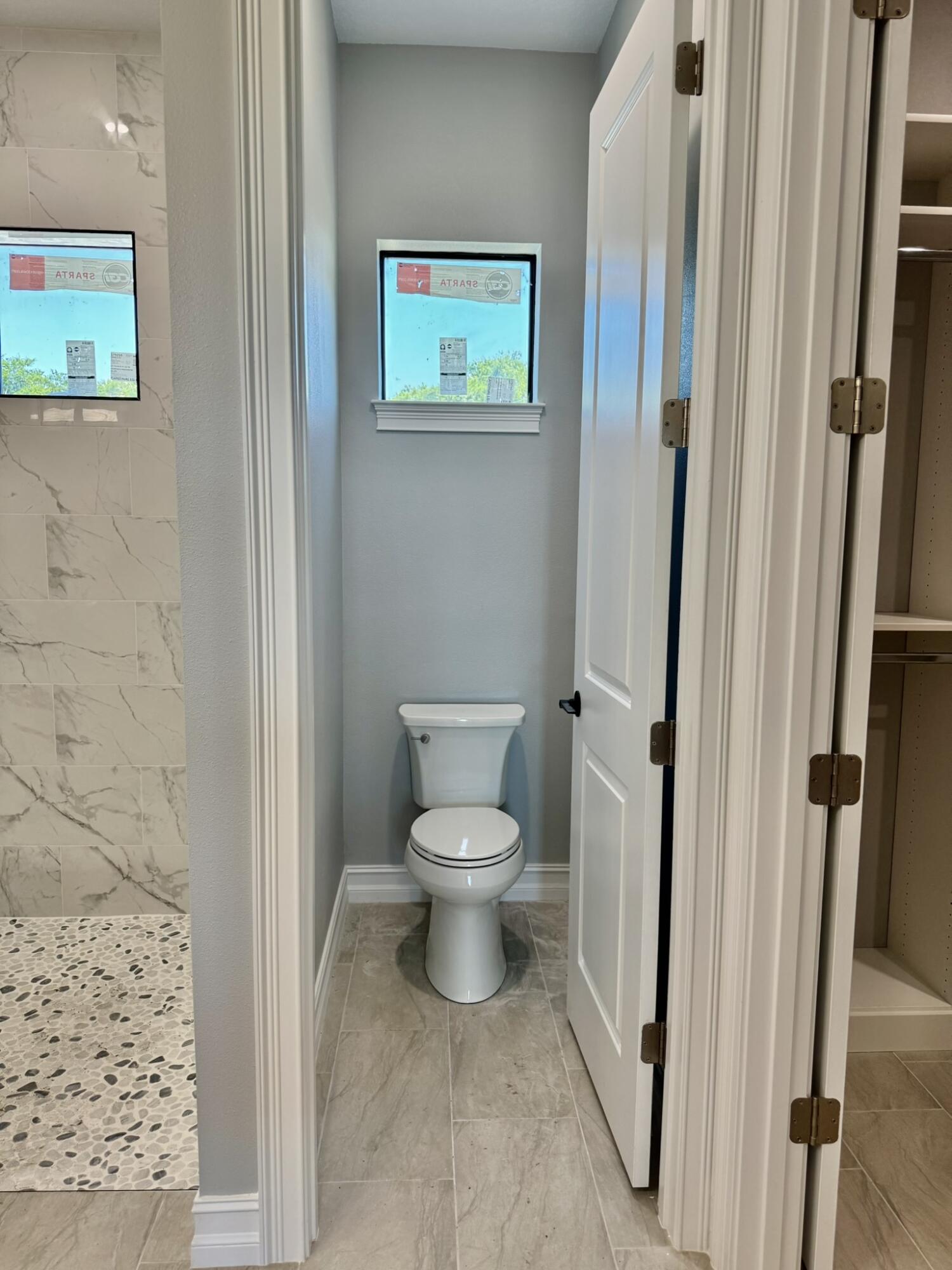 13200 Highway 441 Okeechobee, FL 34974 - Photo 21 of 42 a bathroom with a toilet and a shower