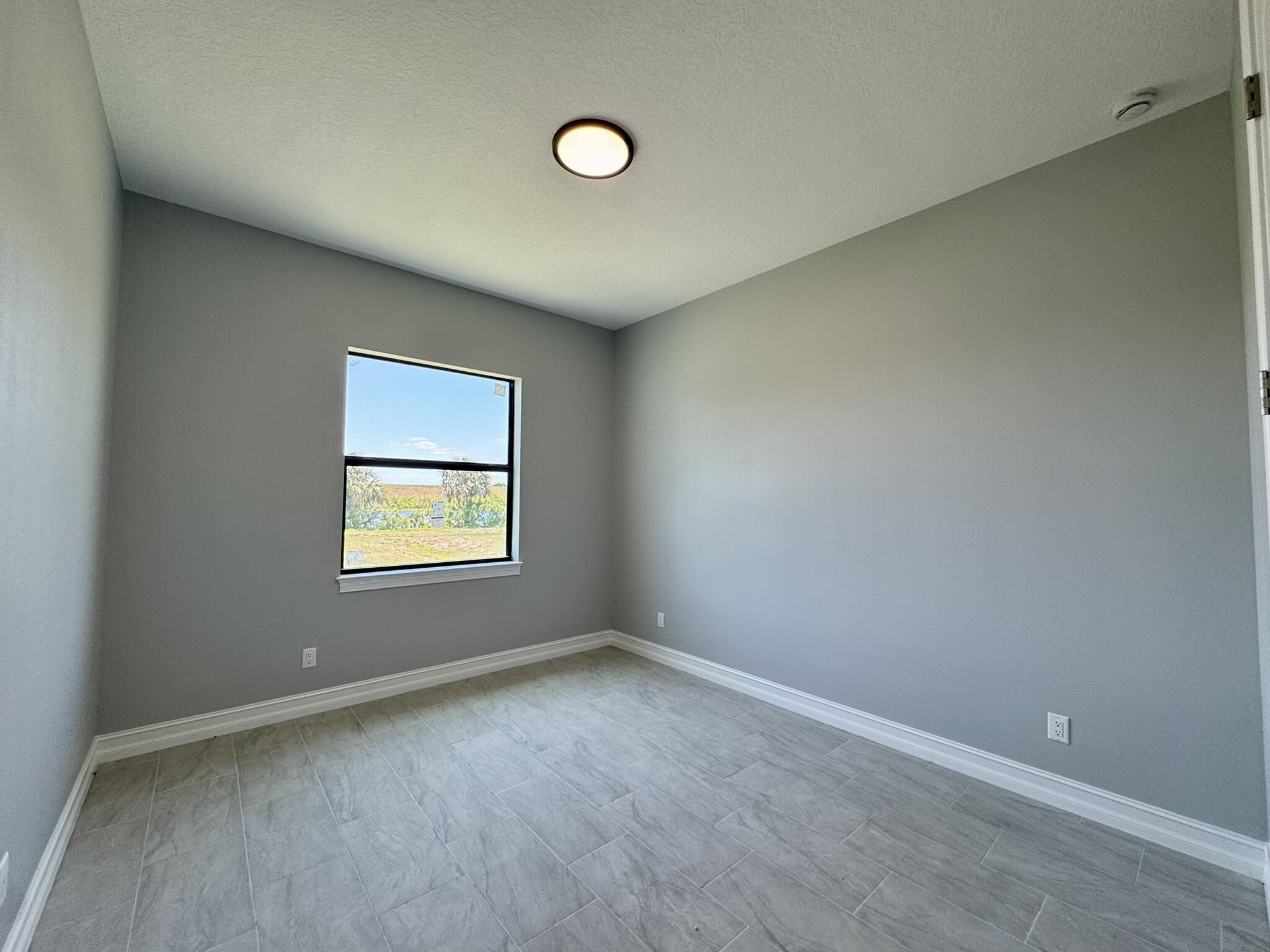 13200 Highway 441 Okeechobee, FL 34974 - Photo 26 of 42 an empty room with a window