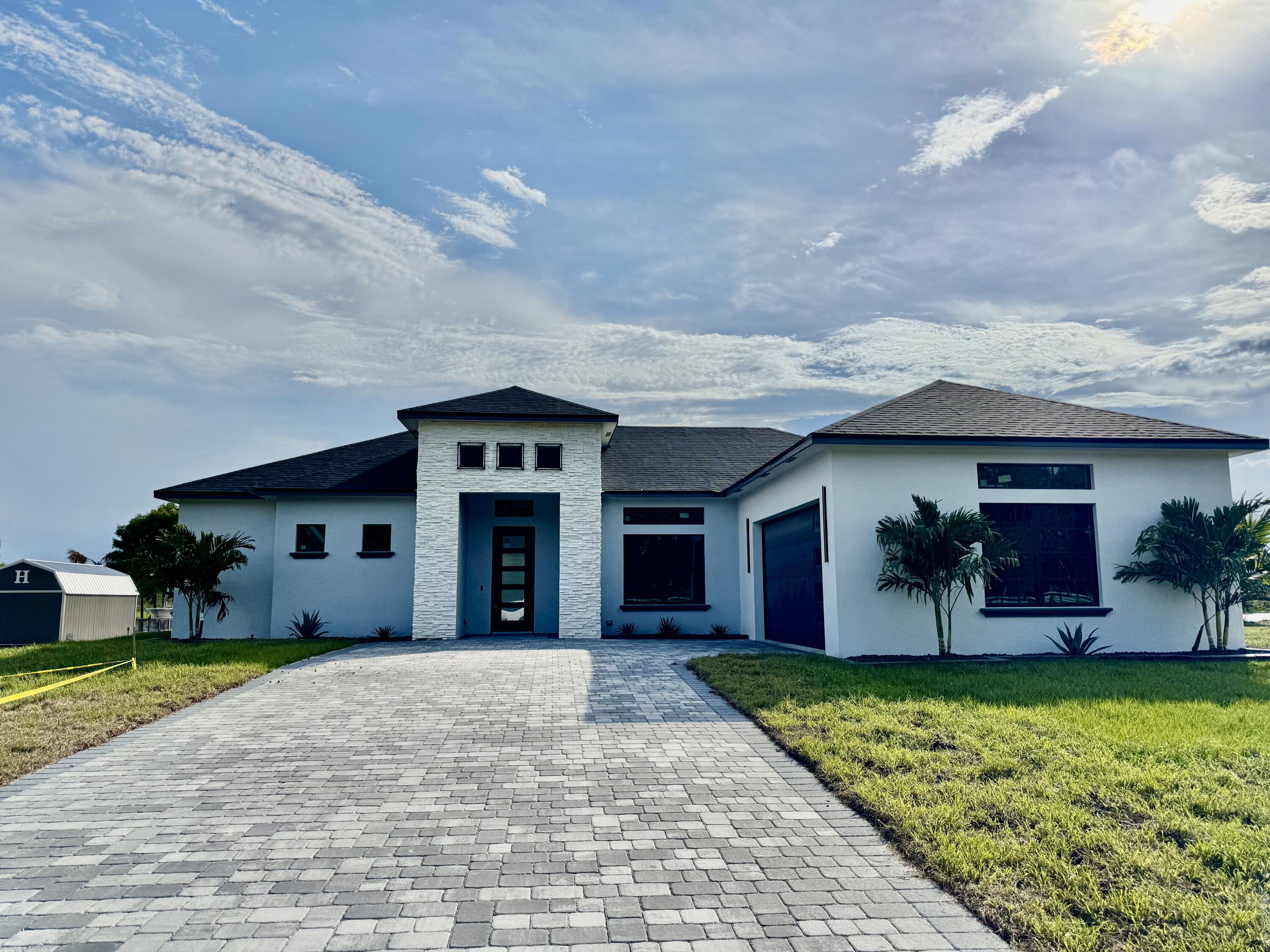 13200 Highway 441 Okeechobee, FL 34974 - Photo 32 of 42 a view of a house with a yard