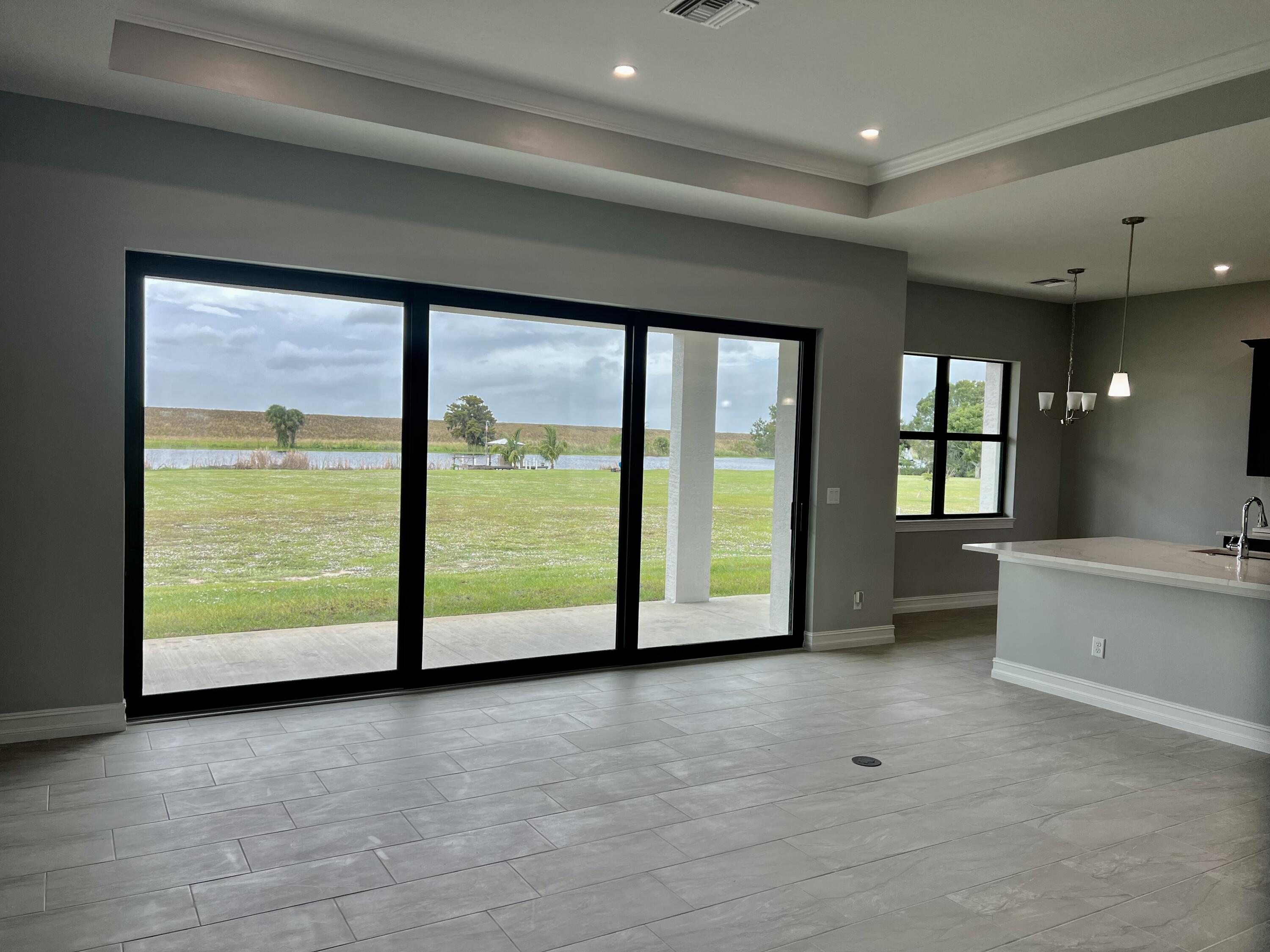 13200 Highway 441 Okeechobee, FL 34974 - Photo 4 of 42 a view of an empty room with window kitchen view and living room